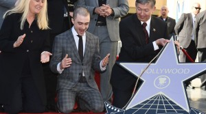 Actor Daniel Radcliffe receives a star on the Hollywood Walk of Fame, November 12, 2015 in Hollywood, California. The British actor, best known for the role of Harry Potter, earned the Walk of Fame's 2,565th star, located in front of the Dolby Theatre on Hollywood Boulevard.  At left is Hollywood Chamber of Commerce Pesident and CEO Leron Gubler.  AFP PHOTO/ ROBYN BECK