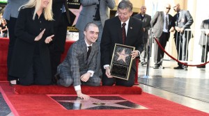 Actor Daniel Radcliffe(C) receives a star on the Hollywood Walk of Fame with Hollywood Chamber of Commerce President and CEO Leron Gubler(R), November 12, 2015 in Hollywood, California. The British actor, best known for the role of Harry Potter, earned the Walk of Fame's 2,565th star, located in front of the Dolby Theatre on Hollywood Boulevard.  AFP PHOTO / ROBYN BECK