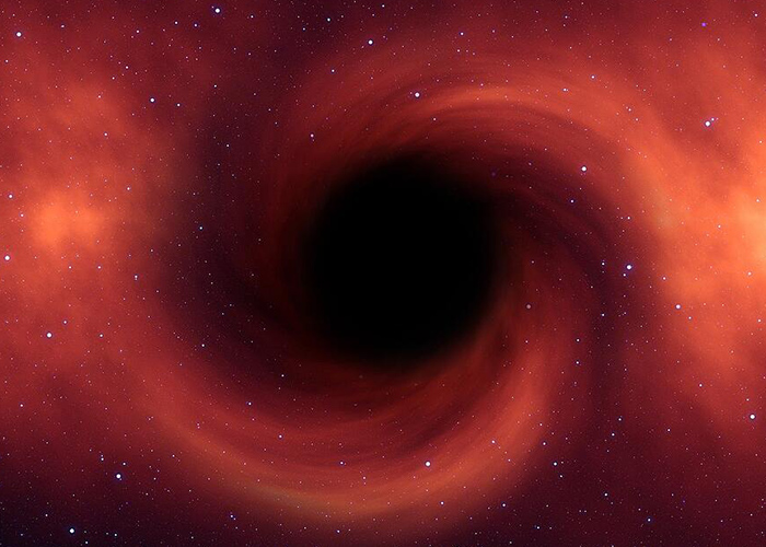 Descubren agujero negro supermasivo que come una tierra por segundo